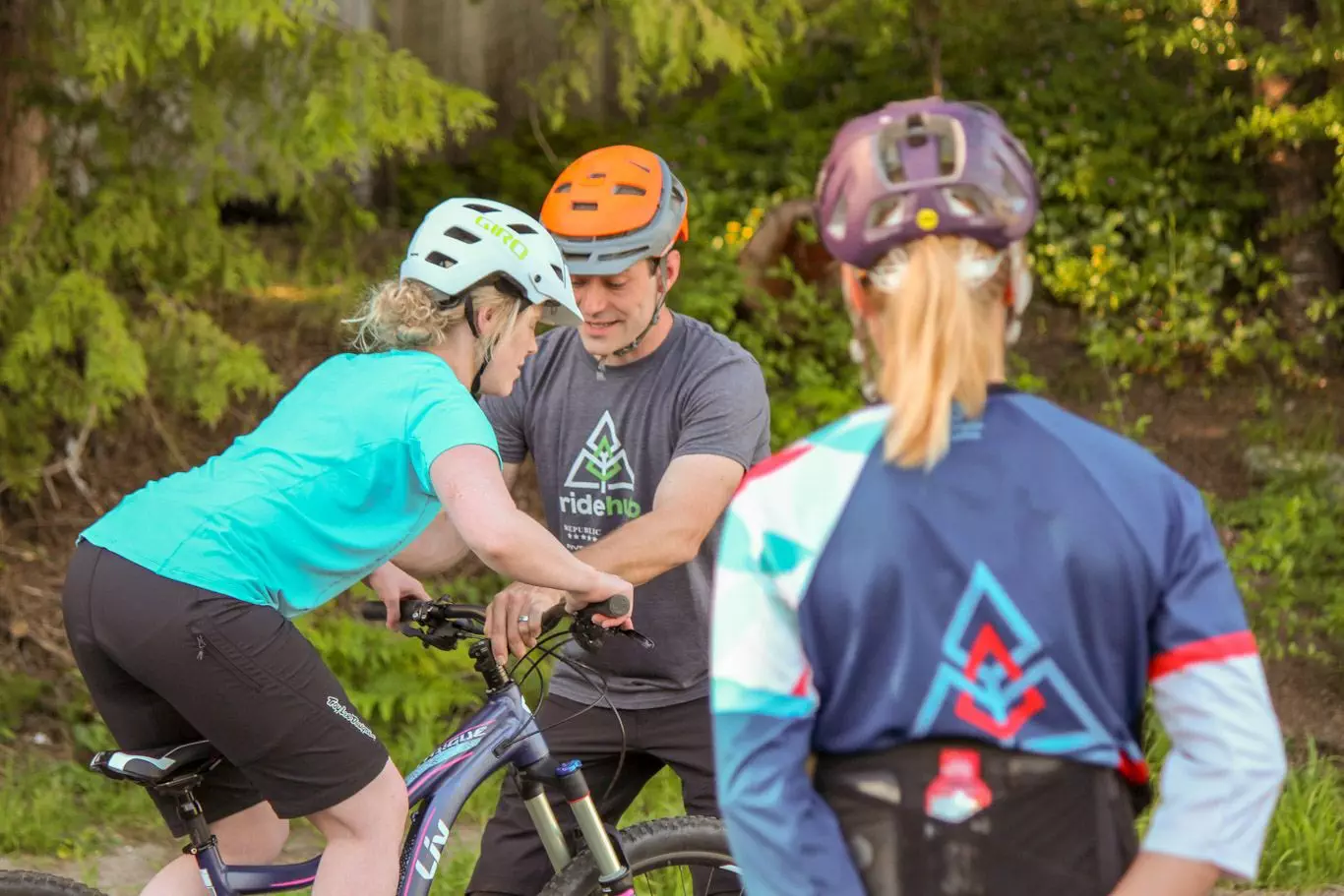 A group of adventurous people riding bikes in the woods, fueled by coffee in Squamish.