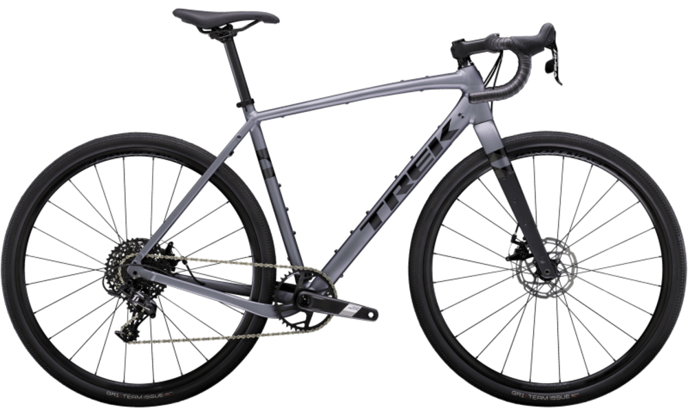 A sleek, gray gravel bike with drop handlebars, disc brakes, and black tires.