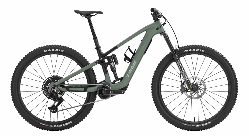 RideHub 23 A matte green full-suspension mountain bike with thick Maxxis tires, disc brakes, and a robust frame is shown against a white background.