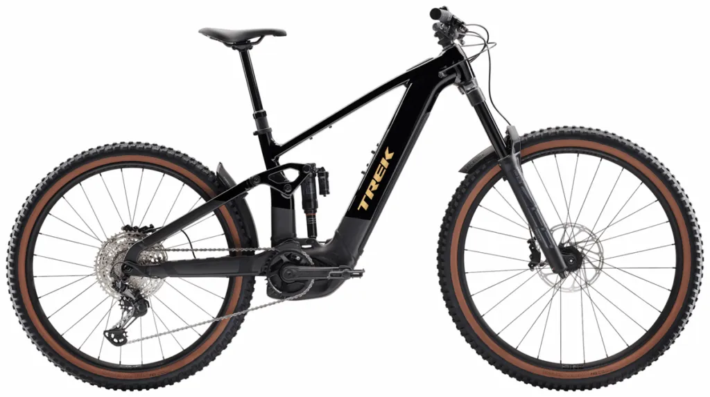 RideHub 19 A black Trek electric mountain bike with a front suspension fork, thick knobby tires, and visible battery mounted on the frame.